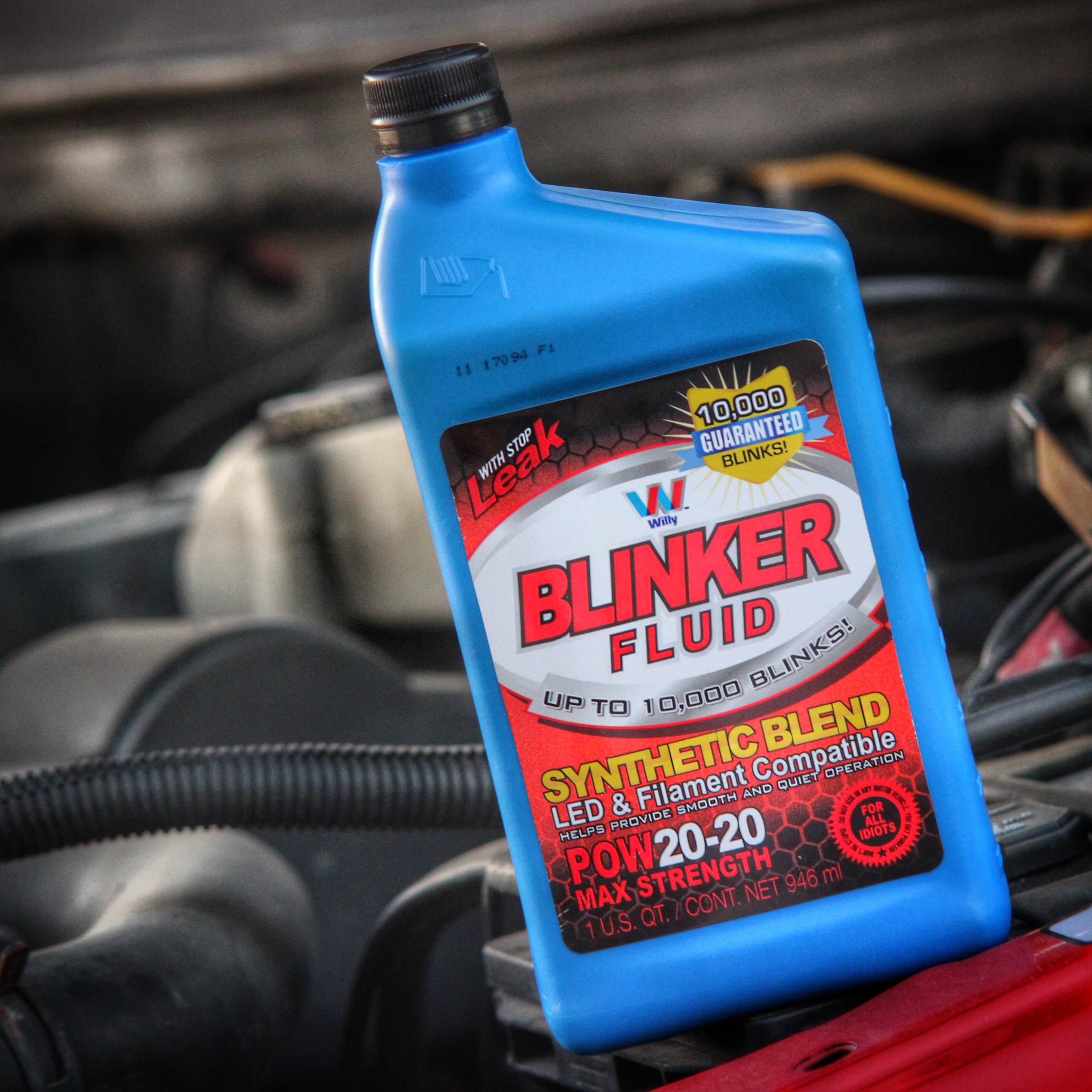 Blinker Fluid sticker displayed in an automotive engine bay