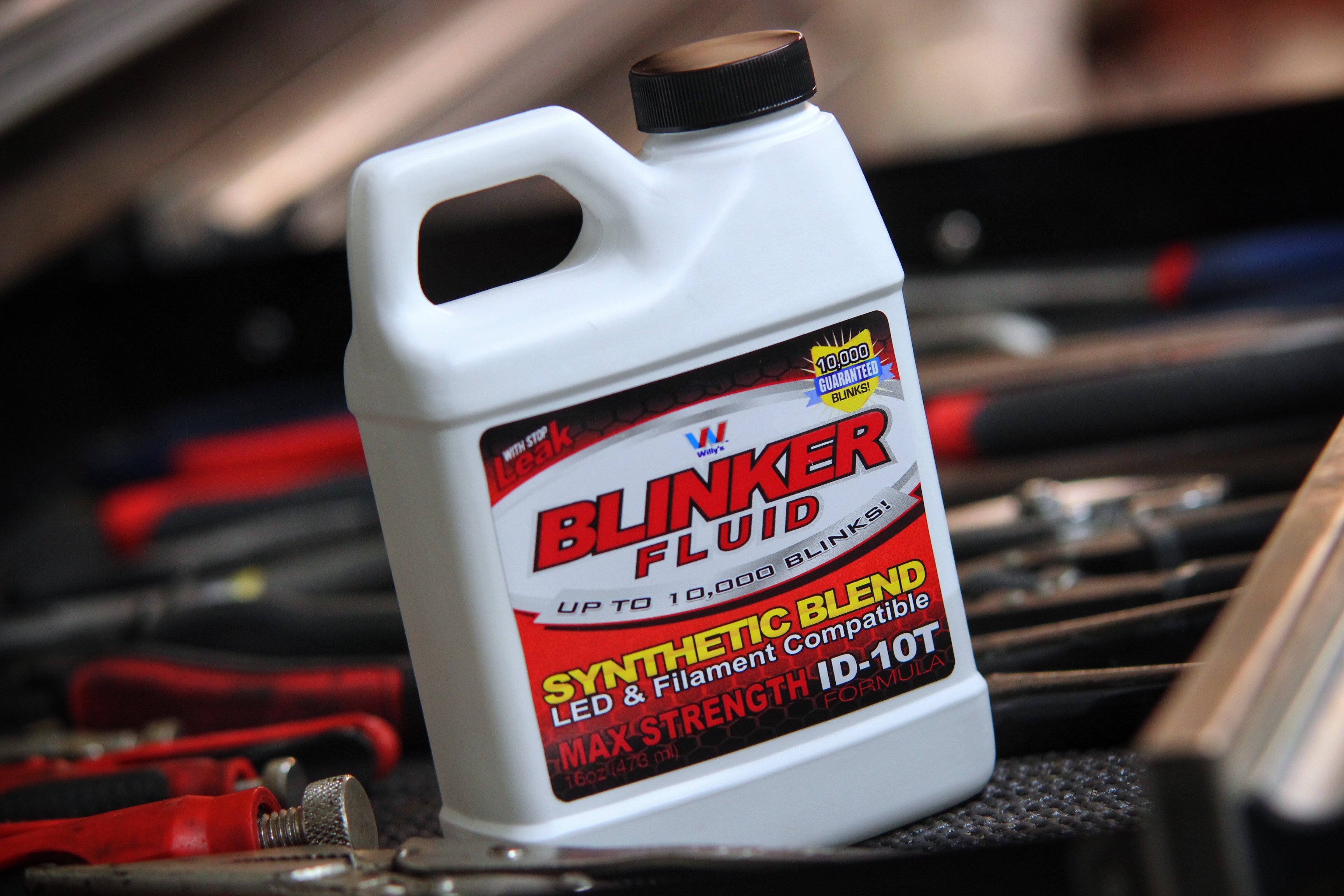 Blinker Fluid gag gift bottle displayed on a toolbox in a shop