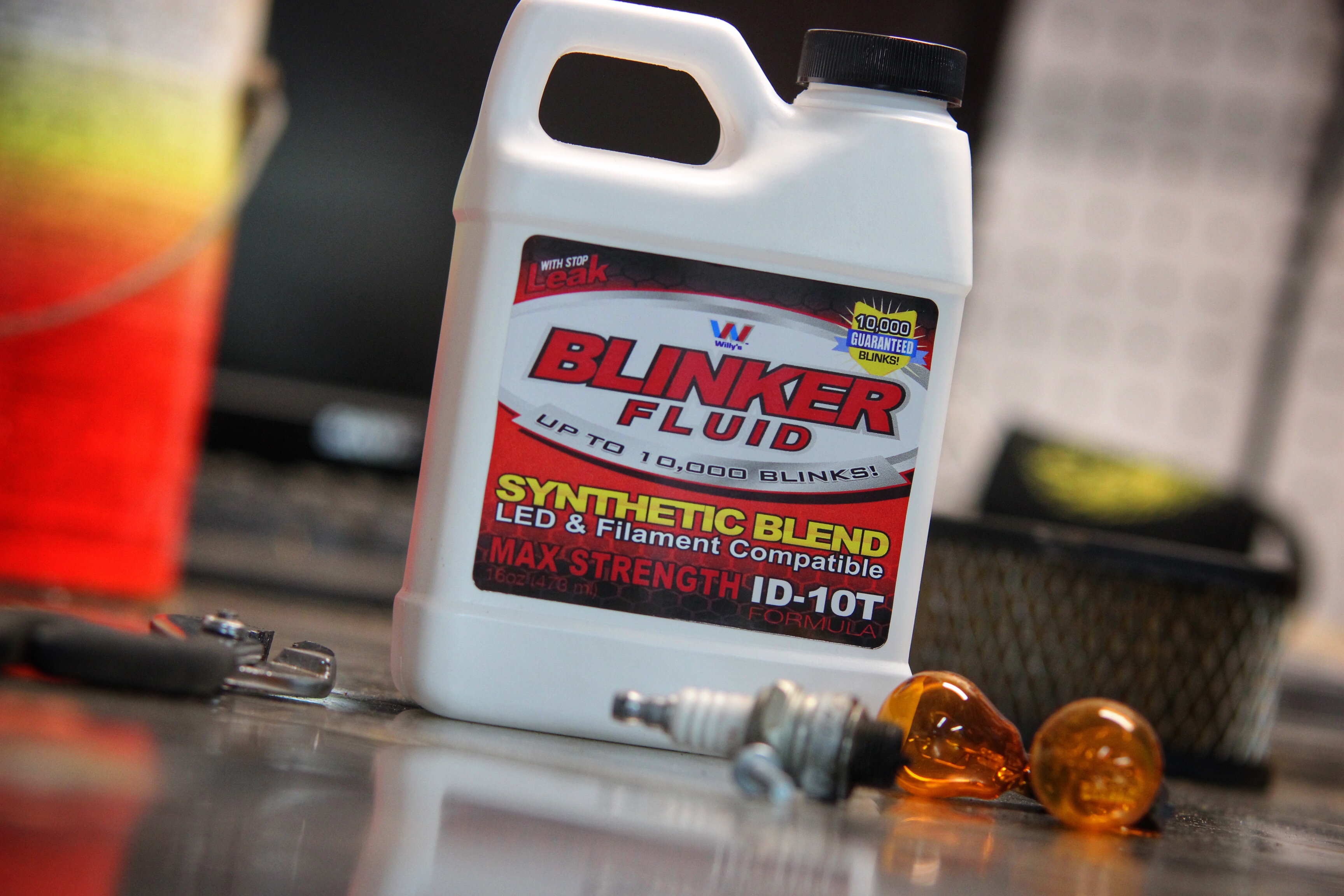 Blinker Fluid gag gift bottle displayed on a garage workbench